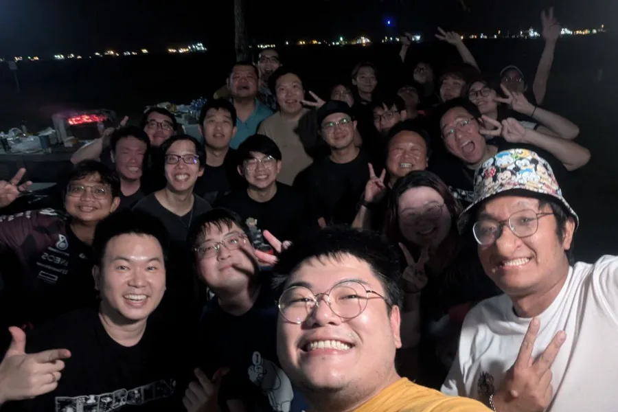 A night-time group selfie with the Greatest Studios community