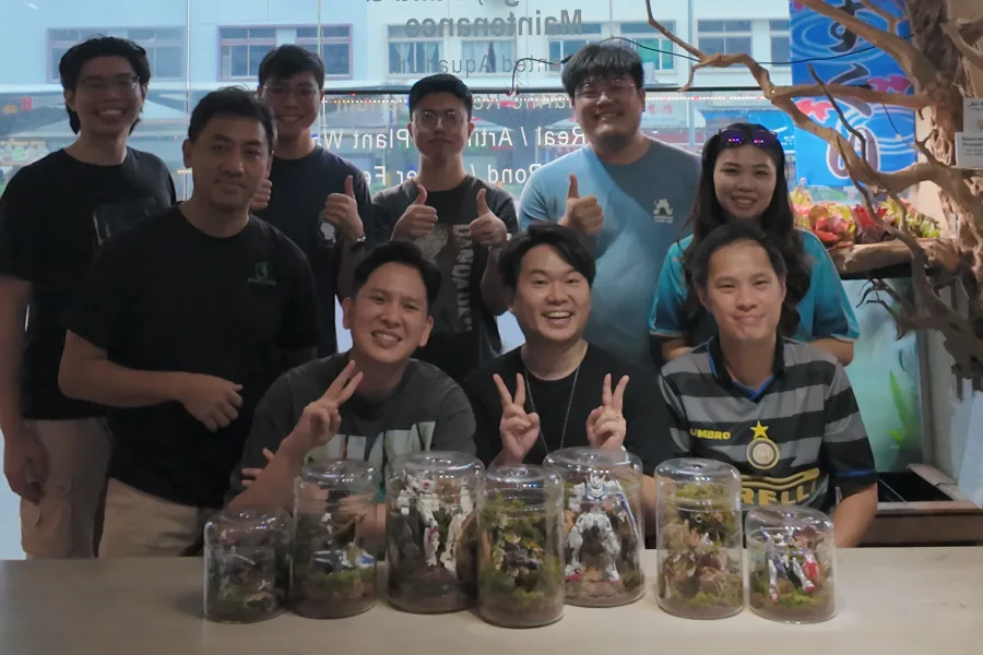 Builders with their terrariums at the Greatest Build Together Terrarium Special